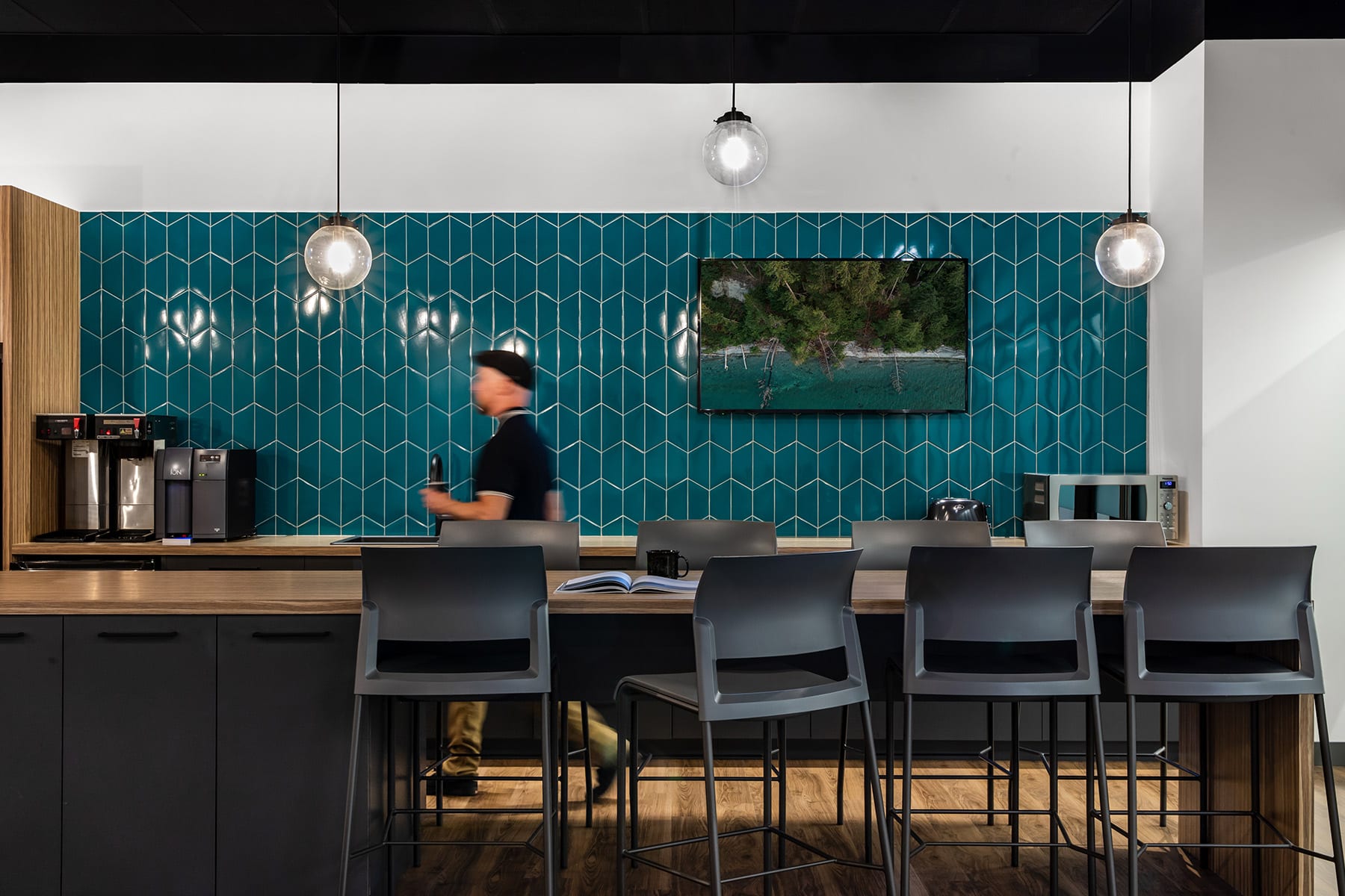 Newly constructed modern staff lunchroom. Turquoise kitchen tiles.